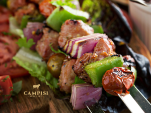 A selection of cured meats, cheese, olives and bread makes a simple starter for an Australian BBQ gathering.